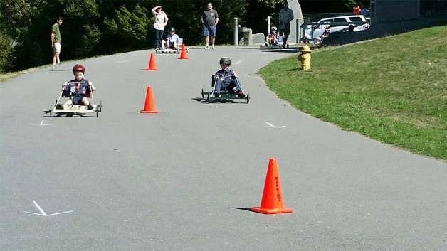 Cub Scouts from Pack 4545 race their carts at Sakai Intermediate School.