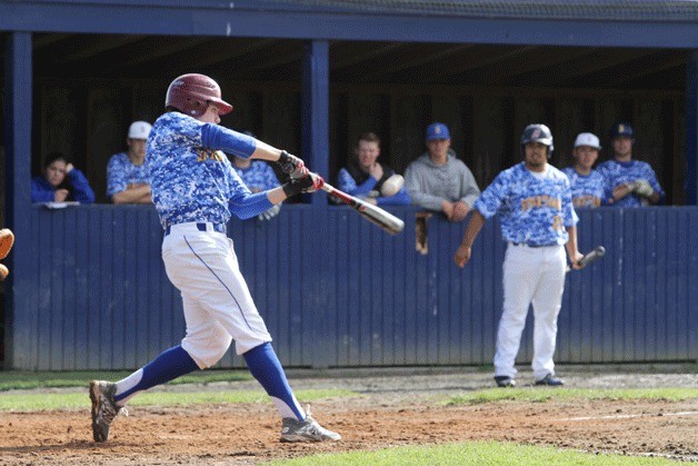 The Spartans' Jack Post connects on a pitch during Bainbridge's lopsided win over Chief Sealth.