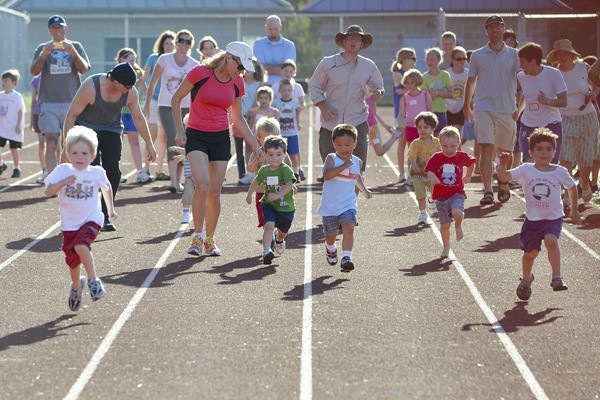 Youngsters fly through the starting gates during one of last year's All-Comers Track Meets.