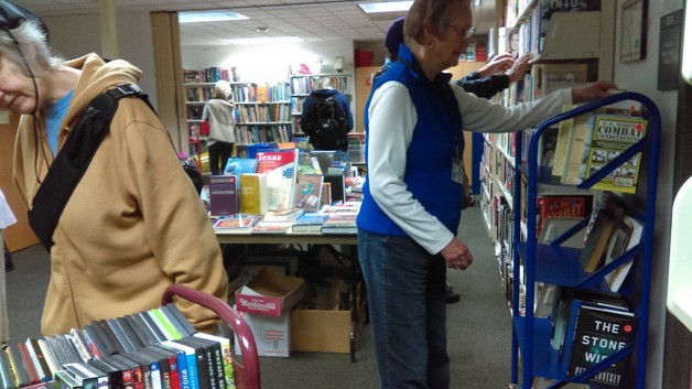 Islanders peruse the offerings at a recent Friends of the Library book sale.