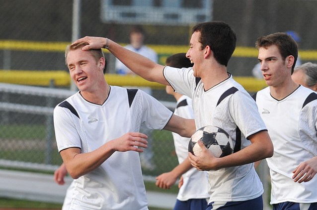 Ben Van Drunen (left) gets a congrats from teammate Chandler Foster. Van Drunen was a Metro Mountain second team selection while Foster was honorable mention.