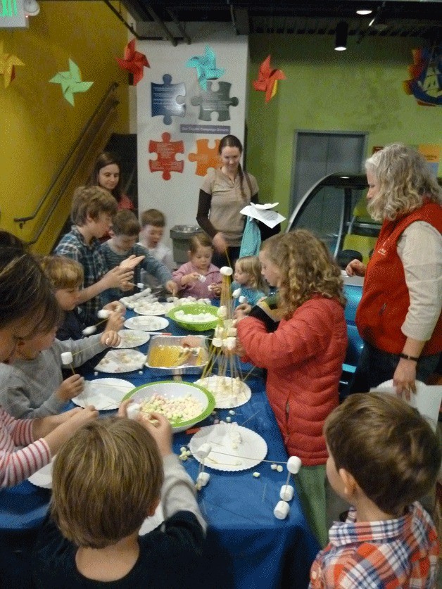 Kids have fun making marshmallow molecules at a recent Discovery Friday at KiDiMu.