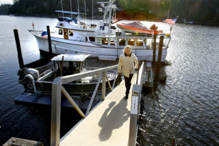 Mayor Darlene Kordonowy departs the Poulsbo-Bainbridge shuttle for an emergency drill to locate essential off -island staff and ferry them to services.