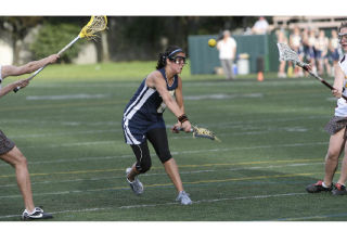 Bainbridge midfielder Mariah Walk shoots the ball during the WSGLA Varsity A state championship game Saturday at Memorial Stadium at Seattle Center. Walk finished with a hat trick.