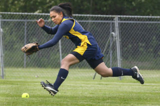 Chelsie Kakela goes after a ground ball during the opening round game of the 3A fastpitch tournament in Tacoma.