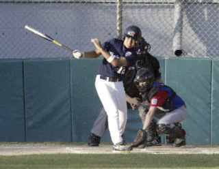 Tino Peleti swings at a pitch during the district tournament earlier in July. He homered in a state semifinal game versus Mill Creek Wednesday. Bainbridge plays at 11 a.m. Saturday.