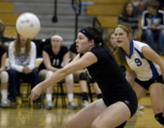 Emily Donohue goes for the bump as Megan Braun looks on.