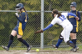 Cara Thompson gets past the tag of Prep’s Jessica Bladow as Brittany Wisner (right) looks on from the on-deck circle. Bainbridge beat Prep 15-0 Monday for their ninth win in a row.