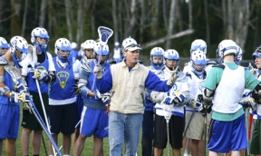 Bainbridge girls lacrosse coach Tami Tommila instructs her team during practice Monday. The team went undefeated for nearly the entire season last year before losing the state championship game to their rival Lakeside in Seattle.