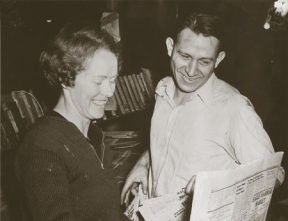 (Clockwise from left) Milly and Walt Woodward take a look at a copy of the Bainbridge Island Review. In a new book