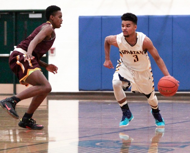 BHS junior guard Marcus Clyde drives the ball down the court early in Tuesday’s game against O’Dea. Despite better play overall