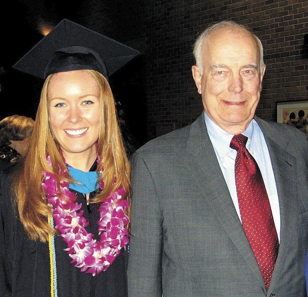 Rebecca Johnson earned her master’s degree at the University of Washington and received the Dan Evans Leadership Award and stands with the namesake of the award