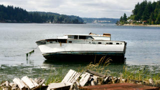 The motor vessel Sunrise sits mired in the mud off Pleasant Beach.The vessel drifted into the ferry lane in Rich Passage Sunday. It was anchored between Point White and Pleasant Beach until Friday