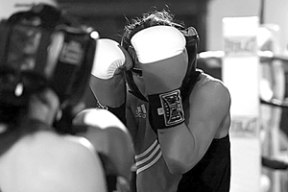 Christina Swanson (right) puts her hands up during one of her bouts at the 2007 Women’s National Golden Gloves tournament in Hollywood