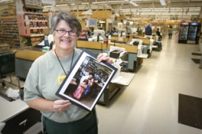 Susan Calhoun holds a photo of her two daughters who were past employees.