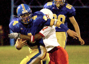 Spencer Evans grinds out the yardage against Renton in Friday's 21-0 Homecoming win.