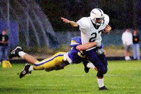 Open-field action in Friday's gridiron play.