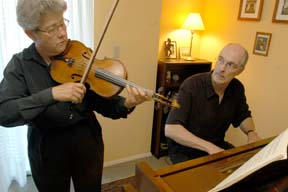 Sandi Schwarz and James Quitslund rehearse for Sunday’s concert.