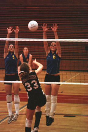 Spartans go to the net in district volleyball action.