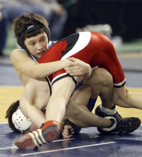 Eli Narte grapple with an opponent at the state wrestling tournament held last weekend.