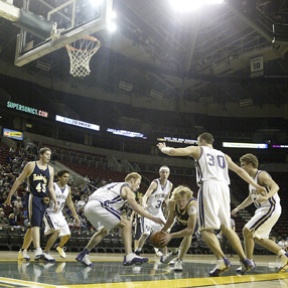 Spartan Grant Leslie snakes through a quartet of defenders during Sunday afternoon’s non-conference exhibition with North Kitsap in the cavernous confines of Seattle’s Key Arena. Powered by another strong inside performance by Coby Gibler