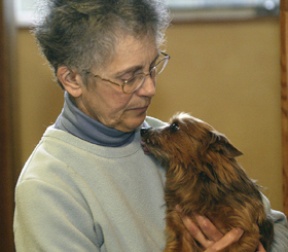 Annette Stollman cuddles with her toothless Yorkie