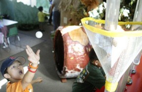 Aaron Wu from Bellevue tosses a ping pong ball into the hugely popular “ball machine” at the Kids Discovery Museum. Since opening in April