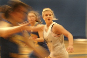 Bainbridge sophomore guard Kirsten Michael (top) looks for the pass during a full-court drill at practice Thursday. Both she and sophomore forward/center Ben Eisenhardt will be key members off the bench for their respective teams in league play.