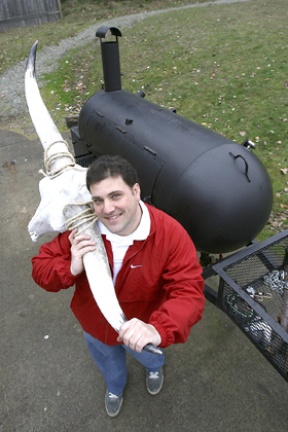 Chef Gregory Epstein stands near the grill at Bainbridge Island Barbeque.