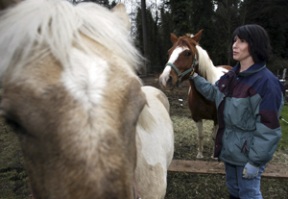 Adrienne Wolfe stands with six-month-old Misty (foreground)