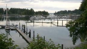 A twilight view from the shoreline at the newly acquired six-acre  park property on Hidden Cove Road at Spargur Loop. The parcel comes with a dock (foreground).