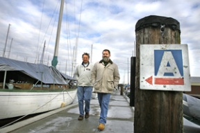 Tod Hornick (right) walks Lloyd Benson at the new Bainbridge Island Yacht Club.