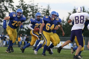 Spartan rushers Max Kauffman (No. 23) rolled behind a line including Gabe Culkin and Tom Hannuksela (Nos. 76