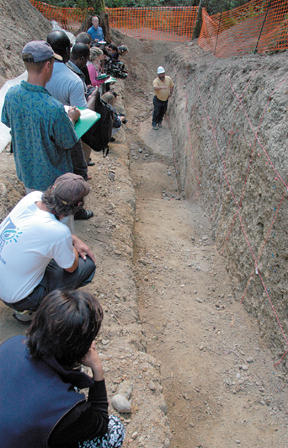 USGS geologist Brian Sherrod points to fault lines at the IslandWood excavation which show evidence of at least two major earthquakes in Bainbridge’s past.