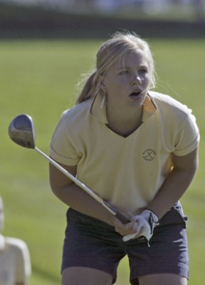 Melanie Trygg watches her drive down the fairway.