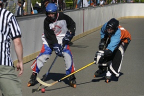 The Bainbridge Roller Hockey division championships played out Saturday afternoon. (L-R) Bruin Matt Perry and Canuck Andrew Strathdee tussle for the ball