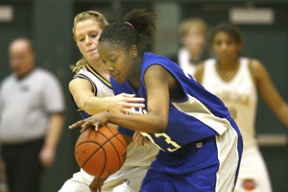 Caitlyn Salo works for the steal against Ingraham guard Destiny White. Salo had 18 points against the Rams as Bainbridge won 56-41.