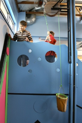 Matthew and Andrew Koken experiment with gravity at the new KiDiMu Motion Madness exhibit.