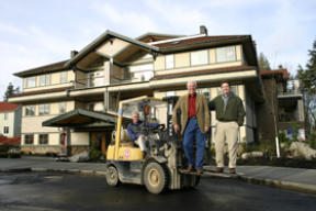 Architect Dennis Kirkpatrick gives a lift to Bruce McCurdy and John Erickson