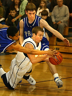 Bainbridge guard Caleb Davis goes for a loose ball in the third quarter of Friday's game against Seattle Prep. The senior scored four points as the Spartans defeated the Panthers 61-41.