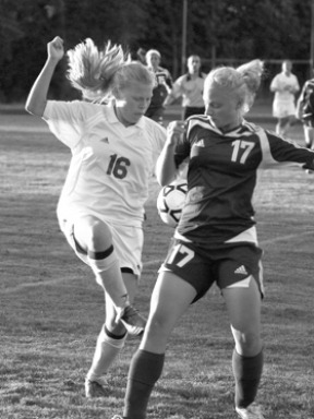 Emily Peters battles North Kitsap's Karina Hoogstede for the ball. Bainbridge defeated North Kitsap 2-0.