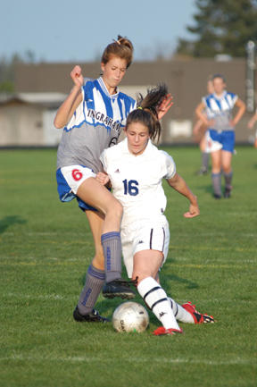 Lindsay Lund (right) takes the low road against midfielder Zena Leonard.