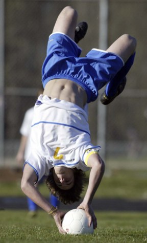 Spartan Zach Mallove executes a somersault throw in.