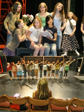 (Above) Fifth and sixth graders from the BPA Theatre School rehearse a scene from “King Midas and the Touch of Gold.” (Below) Bainbridge Performing Arts Education Director Karen Harp-Reed oversees a group number.