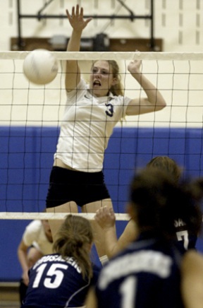 BHS junior Marijke Schwarz Smith spikes the ball at Monday’s game against Eastside Catholic bringing the score to 11-7 in the third match.