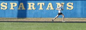 Spartan senior Nolan Amy looks across the Memorial Stadium infield at his competition during a pacing run around the track.