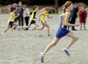 Spartan Caroline Johnson warms up before the Metro League Championship at Lower Woodland Park in Seattle on Thursday.