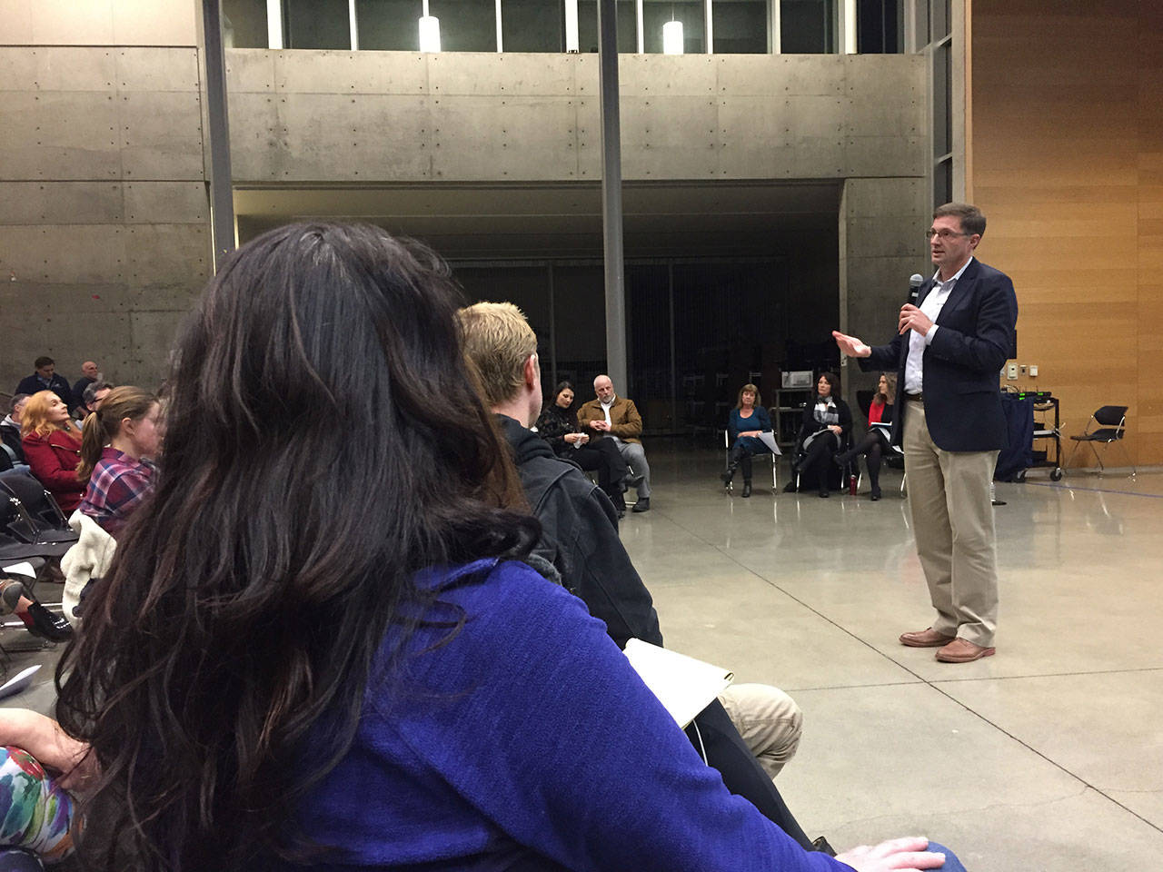 Superintendent Peter Bang-Knudsen addresses a crowd of concerned parents at a special meeting Monday.