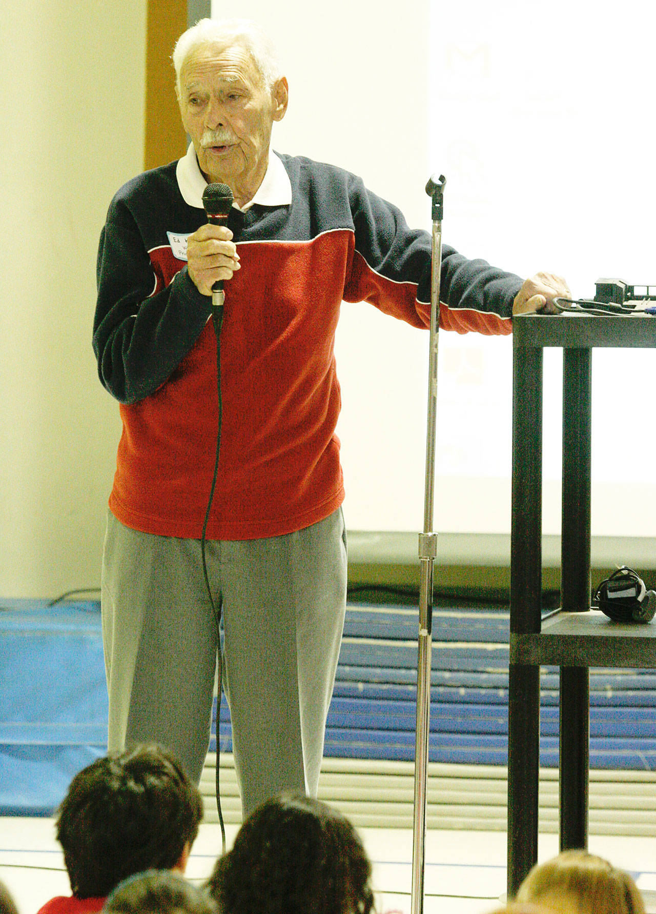 Ed King, the first principal of Wilkes Elementary, talks to students during the last all-school assembly in the old elementary before it closed in 2012. A new Wilkes was rebuilt on the site. (Brian Kelly | Bainbridge Island Review file)