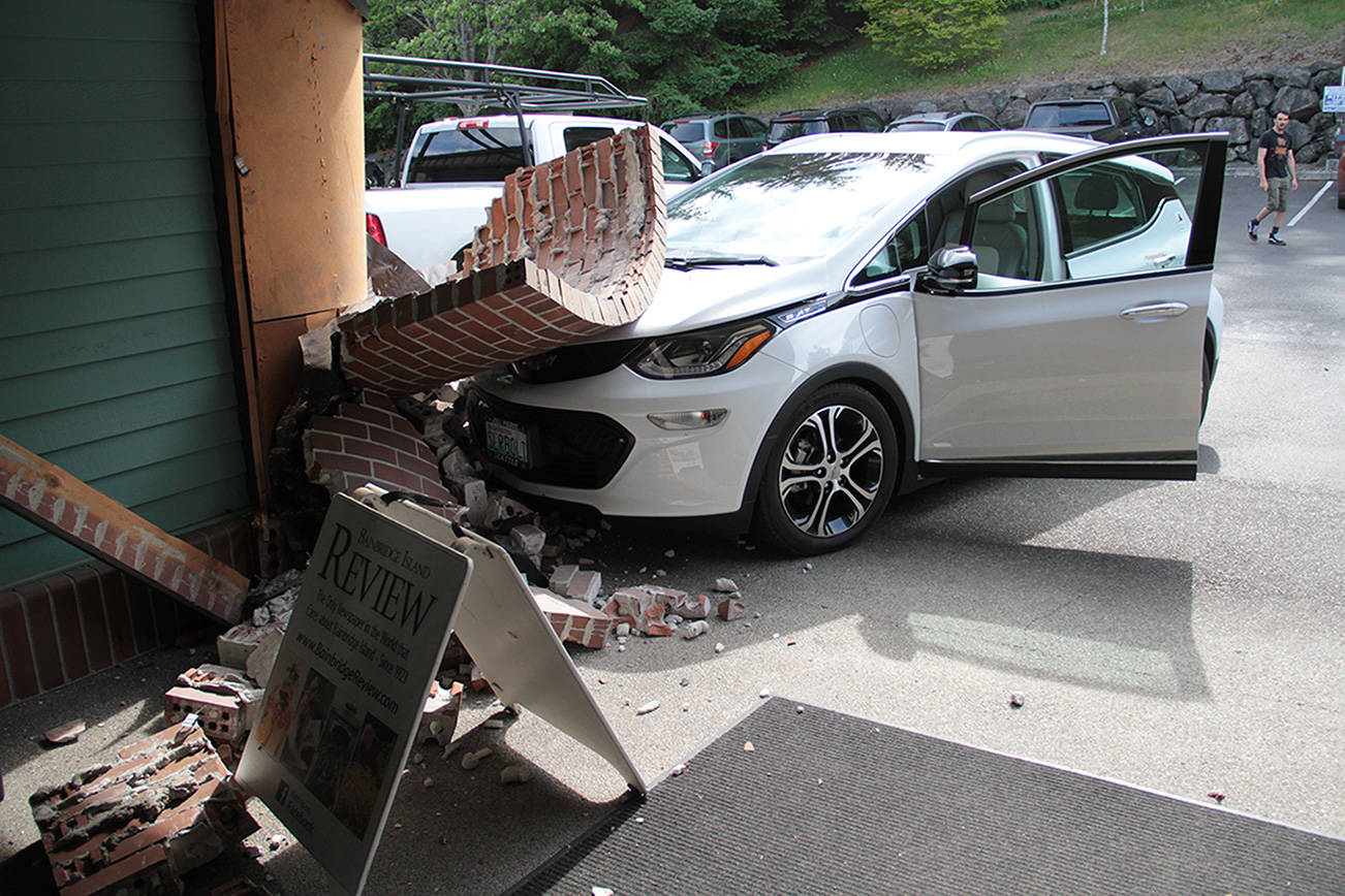 Woman unhurt after car crashes into building